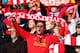 LIVERPOOL, ENGLAND - OCTOBER 05: A Liverpool fan sings during the Barclays Premier League match between Liverpool and Crystal Palace at Anfield on October 5, 2013 in Liverpool, England. (Photo by Clive Brunskill/Getty Images)