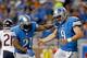 DETROIT, MI - SEPTEMBER 29: Reggie Bush #21 and Matthew Stafford #9 of the Detroit Lions celebrate a touchdown against the Chicago Bears at Ford Field on September 29, 2013 in Detroit, Michigan. (Photo by Gregory Shamus/Getty Images)