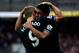 CARDIFF, WALES - SEPTEMBER 22: Paulinho of Tottenham celebrates with team mate Roberto Soldado after scoring the winning goal during the Barclays Premier League match between Cardiff City and Tottenham Hotspur at Cardiff City Stadium on September 22, 2013