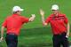 DUBLIN, OH - OCTOBER 05: Brandt Snedeker (L) and Hunter Mahan of the U.S.Team celebrate a birdie on the ninth hole during the Day Three Four-ball Matches at the Muirfield Village Golf Club on October 5, 2013 in Dublin, Ohio. (Photo by David Cannon/Gett
