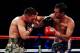 NEW YORK, NY - DECEMBER 03: Delvin Rodriguez (R) of the United States throws a right handed punch to the head of Pawel Wolak of the United States during their IBA Intercontinental Junior Middleweight Title fight at Madison Square Garden on December 3, 20