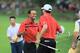 DUBLIN, OH - OCTOBER 05: Tiger Woods and Matt Kuchar of the U.S. Team celebrate on the 18th green after defeating the team of Scott/ Matsuyama 1up during the Day Three Four-ball Matches at the Muirfield Village Golf Club on October 5, 2013 in Dublin, Oh
