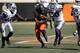 STILLWATER, OK - OCTOBER 5: Wide receiver Jhajuan Seales #81 of the Oklahoma State Cowboys covers the ball before being hit by linebacker Tre Walker #50 of the Kansas State Wildcats October 5, 2013 at Boone Pickens Stadium in Stillwater, Oklahoma. (Pho
