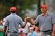 DUBLIN, OH - OCTOBER 04: Matt Kuchar and Tiger Woods of the U.S. Team celebrate after a birdie on the seventh green to halve the hole during the Day Two Foursome Matches at the Muirfield Village Golf Club on October 4, 2013 in Dublin, Ohio. (Photo by M