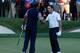 MEDINAH, IL - SEPTEMBER 30: Francesco Molinari of Europe (R) shakes hands with Tiger Woods of the USA on the 18th green after halving his match with Woods during the Singles Matches for The 39th Ryder Cup at Medinah Country Club on September 30, 2012 in