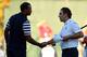 MEDINAH, IL - SEPTEMBER 30: Francesco Molinari of Europe (R) shakes hands with Tiger Woods of the USA on the 18th green after halving his match with Woods during the Singles Matches for The 39th Ryder Cup at Medinah Country Club on September 30, 2012 in
