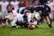 Oct 5, 2013; Evanston, IL, USA; Ohio State Buckeyes quarterback Braxton Miller (5) dives after a fumble with Northwestern Wildcats defensive lineman Tyler Scott (97) during the first quarter at Ryan Field. Mandatory Credit: Jerry Lai-USA TODAY Sports