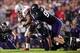 Oct 5, 2013; Evanston, IL, USA; Ohio State Buckeyes running back Carlos Hyde (34) is tackled by Northwestern Wildcats safety Ibraheim Campbell (24) and defensive lineman Dean Lowry (94) during the second quarter at Ryan Field. Mandatory Credit: Jerry Lai-