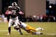 STARKVILLE, MS - OCTOBER 05: Rashard Robinson #21 of the LSU Tigers tackles Joe Morrow #16 of the Mississippi State Bulldogs during a game at Davis Wade Stadium on October 5, 2013 in Starkville, Mississippi. (Photo by Stacy Revere/Getty Images)