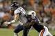 Oct 5, 2013; Auburn, AL, USA; Mississippi Rebels quarterback Bo Wallace (14) is tackled by Auburn Tigers defensive end Carl Lawson (55) during the first half at Jordan Hare Stadium. Mandatory Credit: John Reed-USA TODAY Sports