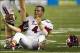 Sep 28, 2013; Honolulu, HI, USA; Fresno State quarterback Derek Carr (4) reacts after losing his helmet in a tackle against Hawaii in the fourth quarter of the NCAA college football game at Aloha Stadium. Mandatory Credit: Marco Garcia-USA TODAY Sports
