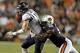 Oct 5, 2013; Auburn, AL, USA; Mississippi Rebels quarterback Bo Wallace (14) is tackled by Auburn Tigers defensive end Carl Lawson (55) during the first half at Jordan Hare Stadium. Mandatory Credit: John Reed-USA TODAY Sports