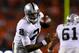 DENVER, CO - SEPTEMBER 23: Quarterback Terrelle Pryor #2 of the Oakland Raiders watches as the ball is snapped over his head during the third quarter against the Denver Broncos at Sports Authority Field Field at Mile High on September 23, 2013 in Denver,