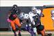 Oct 5, 2013; Stillwater, OK, USA; Kansas State Wildcats quarterback Daniel Sams (4) runs for yardage during the third quarter against Oklahoma State Cowboys linebacker Ryan Simmons (52) at Boone Pickens Stadium. Mandatory Credit: Richard Rowe-USA TODAY S