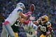 GREEN BAY, WI - OCTOBER 06: Micah Hyde #33 of the Green Bay Packers breaks up a pass in front of Joseph Fauria #80 and Kris Durham #18 of the Detroit Lions during the second quarter at Lambeau Field on October 6, 2013 in Green Bay, Wisconsin. (Photo by