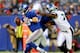 EAST RUTHERFORD, NJ - OCTOBER 06: Eli Manning #10 of the New York Giants is pressured by Vinny Curry #75 of the Philadelphia Eagles at MetLife Stadium on October 6, 2013 in East Rutherford, New Jersey. (Photo by Elsa/Getty Images)