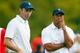 DUBLIN, OH - OCTOBER 06: Tiger Woods and Matt Kuchar of the U.S. Team stand on the green on the 18th hole during the weather-delayed Day Three Foursome Matches at the Muirfield Village Golf Club on October 6, 2013 in Dublin, Ohio. (Photo by Matt Sulliv