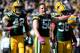 GREEN BAY, WI - OCTOBER 06: A.J. Hawk #50 of the Green Bay Packers reacts to his tackle on third down to stop the Detroit Lions in front of Mason Crosby #2 and Tramon Williams #38 at Lambeau Field on October 6, 2013 in Green Bay, Wisconsin. Green Bay wo