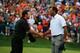 DUBLIN, OH - OCTOBER 06: Tiger Woods of the U.S. Team (R) shakes hands with Richard Sterne of South Africa and the International Team on the 18th green after Woods 1up victory won the Cup for the U.S.Team during the Day Four Singles Matches at the Muirfi