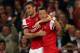 LONDON, ENGLAND - OCTOBER 01: Olivier Giroud (L) of Arsenal is congratulated by teammate Mesut Oezil (R) fter scoring his team's second goal during UEFA Champions League Group F match between Arsenal FC and SSC Napoli at Emirates Stadium on October 1, 20