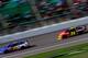 KANSAS CITY, KS - OCTOBER 06: Greg Biffle, driver of the #16 Sherwin Williams Ford, and Jeff Gordon, driver of the #24 Axalta Chevrolet, race during the NASCAR Sprint Cup Series 13th Annual Hollywood Casino 400 at Kansas Speedway on October 6, 2013 in Ka