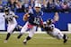 INDIANAPOLIS, IN - OCTOBER 06: Andrew Luck #12 of the Indianapolis Colts is taken down by Jordan Hill #97 of the Seattle Seahawks at Lucas Oil Stadium on October 6, 2013 in Indianapolis, Indiana. (Photo by Jonathan Moore/Getty Images)