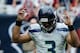 HOUSTON, TX - SEPTEMBER 29: Russell Wilson #3 of the Seattle Seahawks celebrates a touchdown in the second half against the Houston Texans at Reliant Stadium on September 29, 2013 in Houston, Texas. (Photo by Scott Halleran/Getty Images)