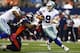 ARLINGTON, TX - OCTOBER 6: Tony Romo #9 of the Dallas Cowboys scrambles to avoid the rush during a game against the Denver Broncos at AT&T Stadium on October 6, 2013 in Arlington, Texas. (Photo by Wesley Hitt/Getty Images)