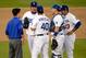 October 6, 2013; Los Angeles, CA, USA; Los Angeles Dodgers pitching coach Rick Honeycutt (40) speaks with starting pitcher Hyun-Jin Ryu (99) in the third inning against the Atlanta Braves in game three of the National League divisional series playoff base