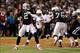Oct 6, 2013; Oakland, CA, USA; Oakland Raiders quarterback Terrelle Pryor (2) passes the ball ahead of pressure by San Diego Chargers inside linebacker Manti Te'o (50) during the first quarter at O.co Coliseum. Mandatory Credit: Kelley L Cox-USA TODAY Spo