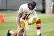 OAKLAND, CA - SEPTEMBER 29: Robert Griffin III #10 of the Washington Redskins prays on the sidelines before their game against the Oakland Raiders at O.co Coliseum on September 29, 2013 in Oakland, California. (Photo by Ezra Shaw/Getty Images)