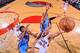 PORTLAND, OR - APRIL 12: Damian Lillard #0 of the Portland Trail Blazers shoots a layup against Russell Westbrook #0 and Hasheem Thabeet #34 of the Oklahoma City Thunder on April 12, 2013 at the Rose Garden Arena in Portland, Oregon. NOTE TO USER: User ex