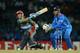 COLOMBO, SRI LANKA - SEPTEMBER 19: Karim Sadiq of Afghanistan bats watched by India wicketkeeper MS Dhoni during the ICC World Twenty20 2012: Group A match between India and Afghanistan at R. Premadasa Stadium on September 19, 2012 in Colombo, Sri Lanka