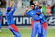 DUBAI , UNITED ARAB EMIRATES - MARCH 24: Dawlat Zadran of Afghanistan celebrates with teammates after taking the wicket of Kevin O'Brien of Ireland for 0 during the ICC World Twenty20 qualifier final between Ireland and Afghanistan at the Dubai Internati