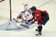 WASHINGTON, DC - OCTOBER 03: Alex Ovechkin #8 of the Washington Capitals score in the shootout against Karri Ramo #31 of the Calgary Flames at the Verizon Center on October 3, 2013 in Washington, DC. The Capitals defeated the Flames 5-4 in the shootout.