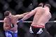 Jan 28, 2012; Chicago, IL, USA; UFC fighter Demian Maia (left) fights against Chris Weidman during UFC on Fox 2 at the United Center. Weidman defeats Maia. Mandatory Credit: Mike Dinovo-USA TODAY Sports