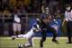 Oct 5, 2013; Waco, TX, USA; Baylor Bears running back Lache Seastrunk (25) eludes West Virginia Mountaineers linebacker Sean Walters (13) during the first half at Floyd Casey Stadium. The Bears defeated the Mountaineers 73-42. Mandatory Credit: Jerome Mir