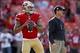 Head coach Jim Harbaugh (right) has called out Kaepernick before.
