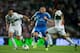 Benzema brings the ball through a crowd against Elche.