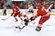 RALEIGH, NC - OCTOBER 06: Wayne Simmonds #17 of the Philadelphia Flyers reaches in to knock the puck away from Andrej Sekera #4 of the Carolina Hurricanes during play at PNC Arena on October 6, 2013 in Raleigh, North Carolina. (Photo by Grant Halverson/