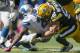 GREEN BAY, WI - OCTOBER 6: Clay Matthews #52 of the Green Bay Packers makes a tackle on Reggie Bush #21 of the Detroit Lions at Lambeau Field on October 6, 2013 in Green Bay, Wisconsin. (Photo Tom Lynn /Getty Images)
