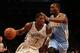 Feb 13, 2013; New York, NY, USA; Brooklyn Nets shooting guard Joe Johnson (7) drives around Denver Nuggets small forward Jordan Hamilton (1) during the third quarter at Barclays Center. Nets won 119-108. Mandatory Credit: Anthony Gruppuso-USA TODAY Spo