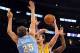 Oct 6, 2013; Los Angeles, CA, USA; Los Angeles Lakers forward Pau Gasol (16) shoots over Denver Nuggets center Timofey Mozgov (25) during the first half at Staples Center. Mandatory Credit: Christopher Hanewinckel-USA TODAY Sports