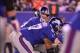 Dec 4, 2011; East Rutherford, NJ, USA; New York Giants quarterback Eli Manning (10) looks down the offensive line during the first half of their game against the Green Bay Packers at MetLife Stadium. Mandatory Credit: Ed Mulholland-USA TODAY Sports