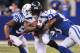 INDIANAPOLIS, IN - OCTOBER 06: Marshawn Lynch #24 of the Seattle Seahawks is taken down by Jerrell Freeman #50 and Kavell Conner #53 of the Indianapolis Colts during a game at Lucas Oil Stadium on October 6, 2013 in Indianapolis, Indiana. (Photo by Jona