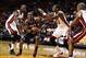 Bosh (left) defends during Monday's preseason-opening win over the Hawks.