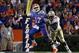 November 26, 2011; Gainesville FL, USA; Florida State Seminoles defensive end Cornellius Carradine (91) defends Florida Gators quarterback Jacoby Brissett (17) during the second half at Ben Hill Griffin Stadium. Florida State Seminoles defeated the Florid