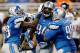 DETROIT, MI - SEPTEMBER 29: Rookie Ezekiel Ansah #94 of the Detroit Lions celebrates with teammates Willie Young #79 and Nick Fairley #98 while playing the Chicago Bears at Ford Field on September 29, 2013 in Detroit, Michigan. (Photo by Gregory Shamus/Ge