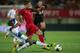 FARO, PORTUGAL - AUGUST 14: Cristiano Ronaldo (R) of Portugal competes for the ball with Bruno Martins Indi (L) of Netherlands during the International Friendly match between Portugal and Netherlands at Estadio Algarve on August 14, 2013 in Faro, Portugal
