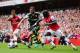 LONDON, ENGLAND - SEPTEMBER 22: Erik Pieters (C) of Stoke City holds off the challenge of Mathieu Flamini (L) and Bacary Sagna (R) of Arsenal during the Barclays Premier League match between Arsenal and Stoke City at Emirates Stadium on September 22, 201